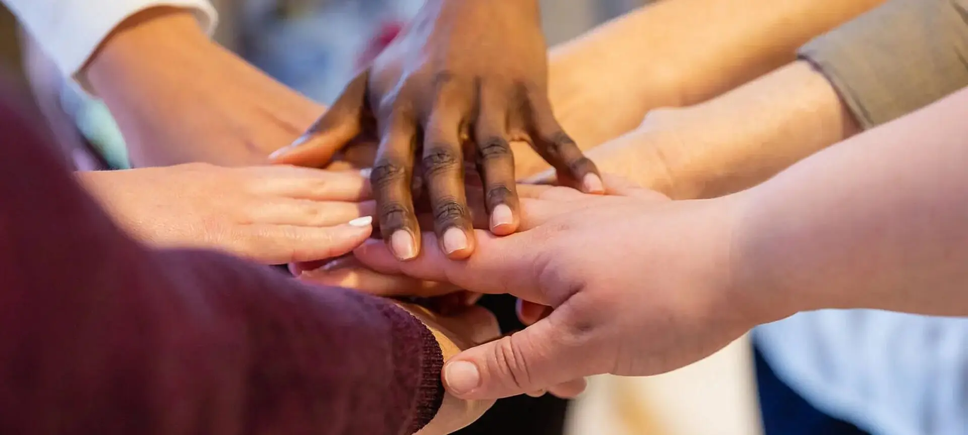 Group of People Joining Their Hands Together